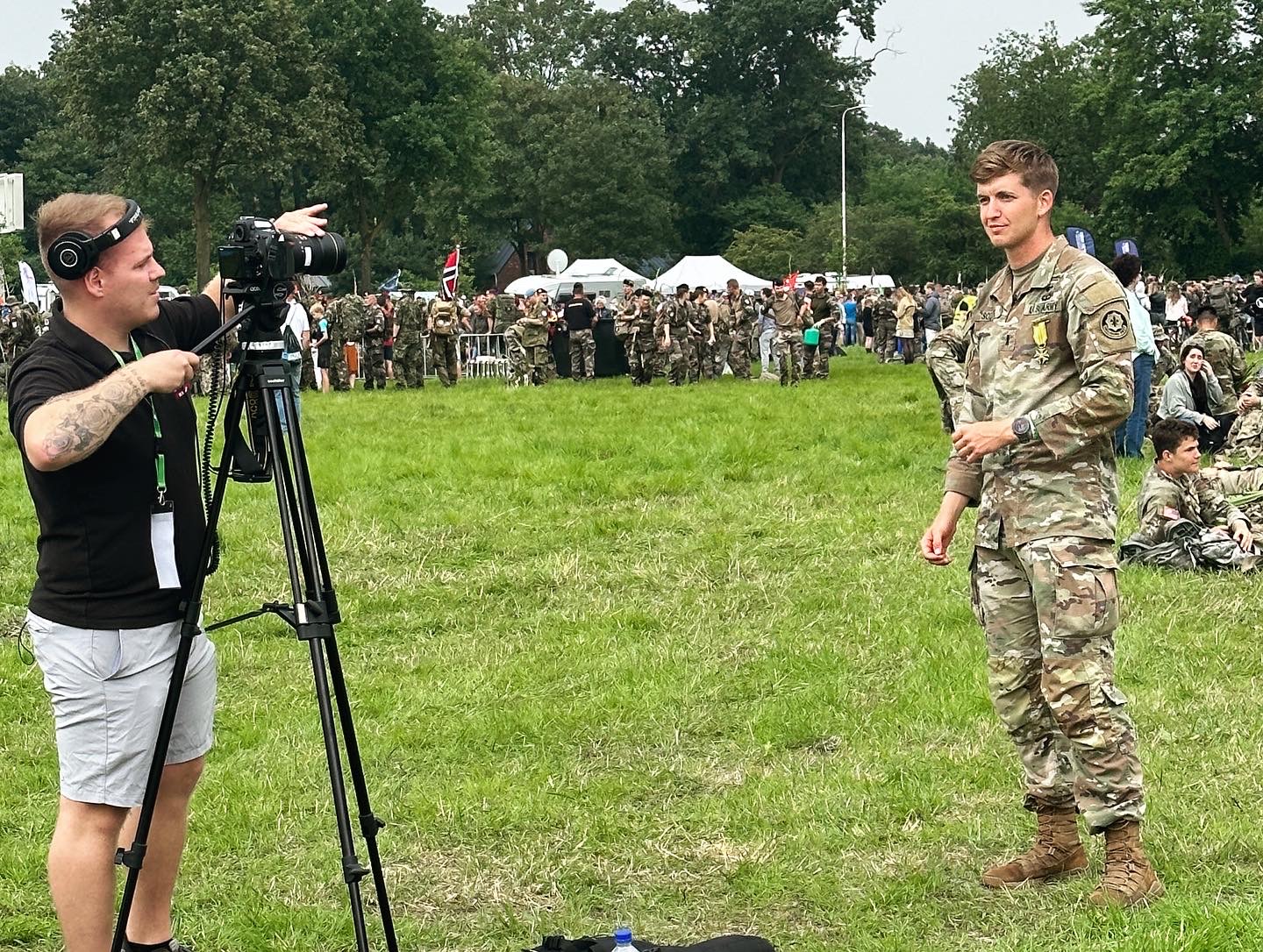 A soldier being filmed at an outdoor gathering in Nijmegen, Netherlands